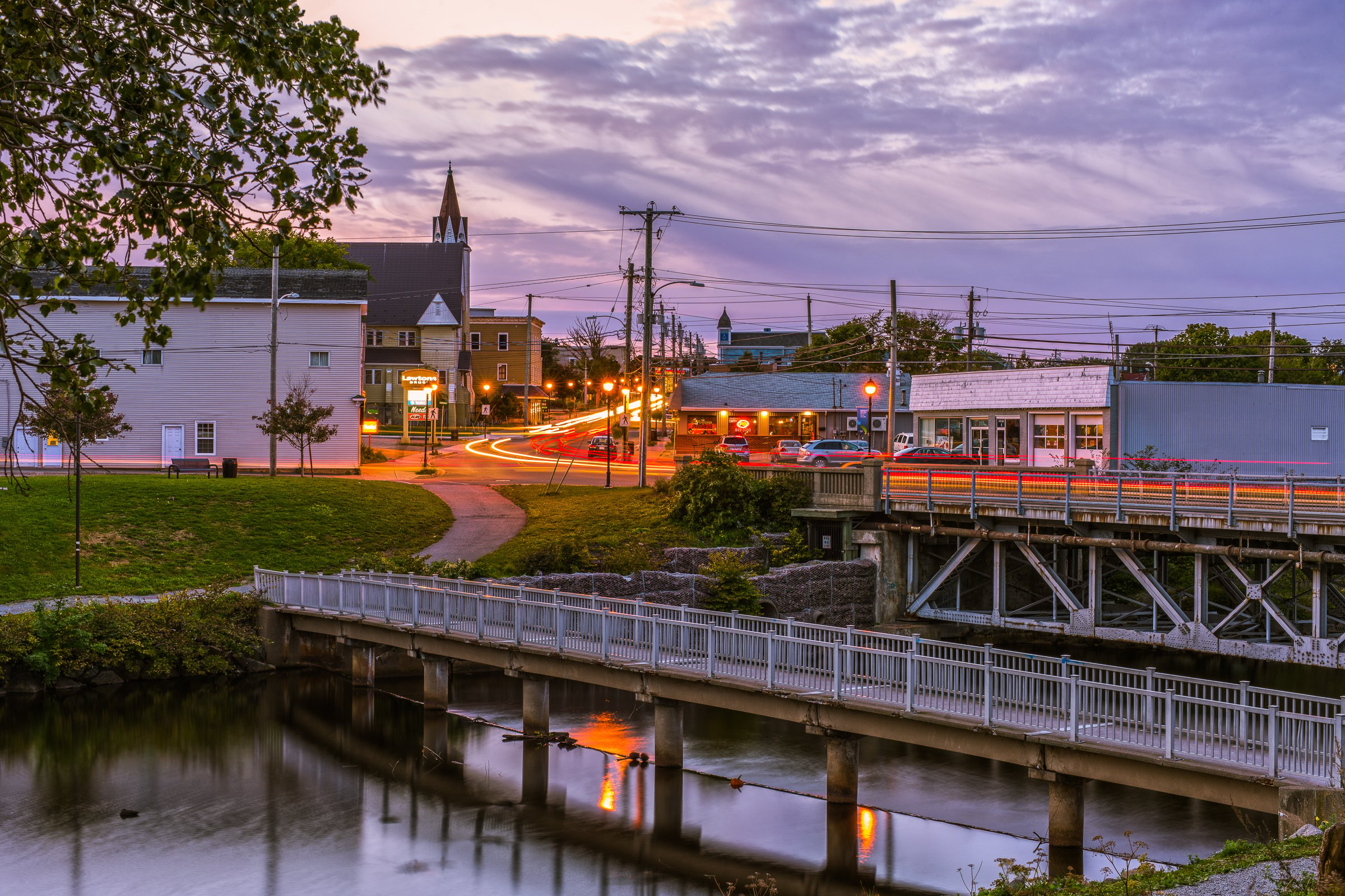 Scenic sunset view of Glace Bay, Cape Breton Island, with warm hues lighting up the town and coastline.